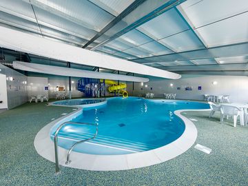 Indoor swimming pool with flume