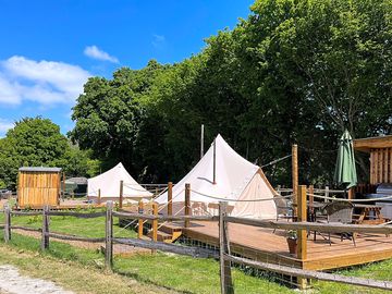 Bell tents on wooden decking