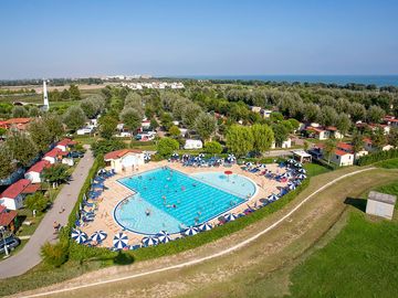 Aerial view of the site and its pool