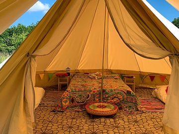 Fully furnished bell tents contain cooking equipment, beds & bed linen