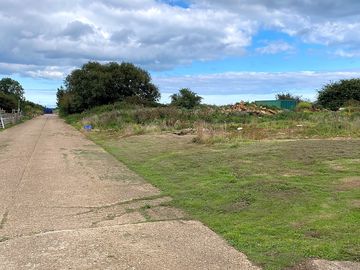 Track to the pitches leading past two nissan huts
