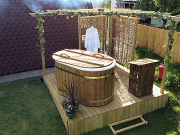 Your own private wood-fired hot tub to laze in during the day or for night-time star-gazing.