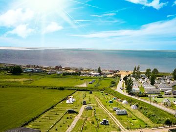 Drone image of the campsite and the sea