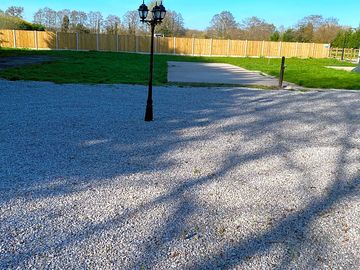 Hardstanding pitch with grass