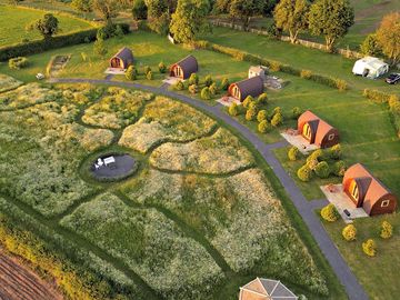 View from above of all our pods in front of the flower meadow