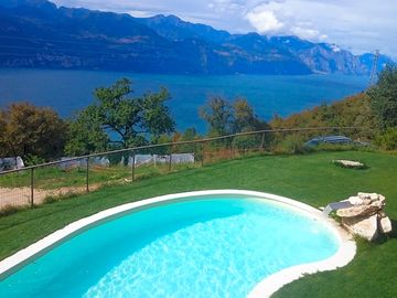The swimming pool overlooks Lake Garda