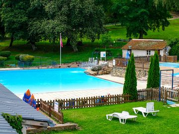 View of the pool with sun loungers