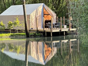 Glamping tent across the lake