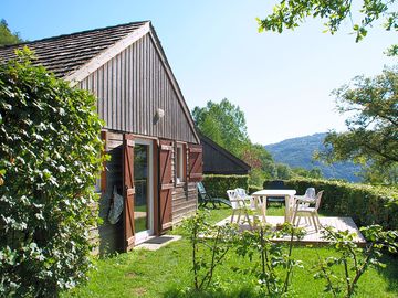 Lodge with deck and outdoor furniture