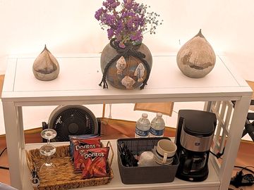 Glamping essentials, elevated fresh flowers, morning coffee, and thoughtful touches