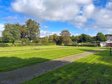 Partially shaded grass pitches