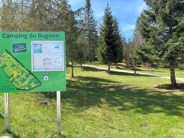 Grassy pitches and a map to the site