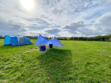Tent and communal sheltered area