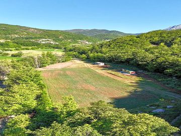 Aerial view of the pitches surrounded by greenery