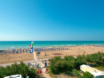 The beach is just outside the campsite