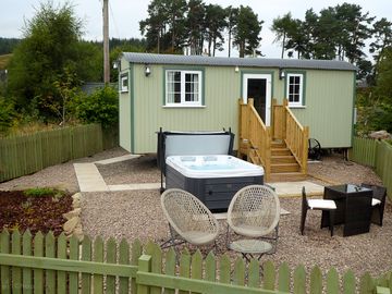 Exterior of the shepherd's hut showing hot tub