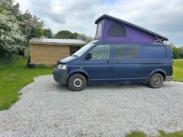 Gravel pitch with hook up and shelter with seating