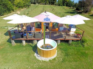 Shaded outdoor deck and hot tub
