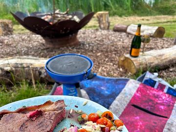 Enjoying alfresco dining at our lakeside communal firepit