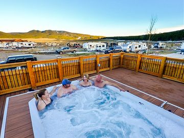 Relax in the large outdoor hot tub