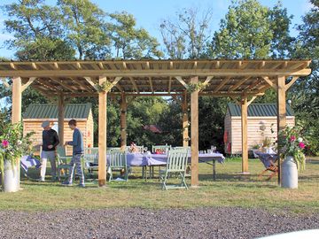 Covered pergola for outside eating and celebrations