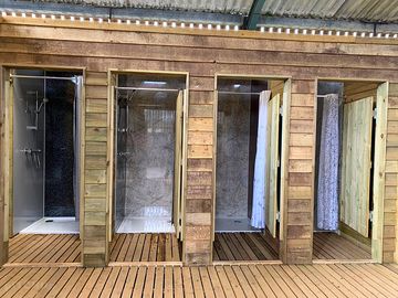 The hot water for shower block is supplied by the farm's biomass boiler