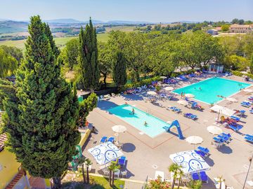 Two swimming pools, one with a slide for the kids