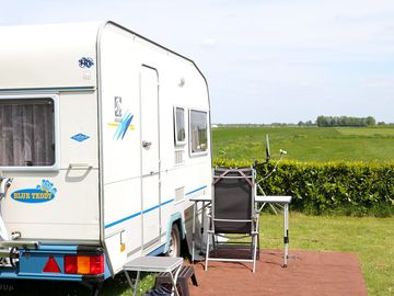 Electric grass pitch with a green view
