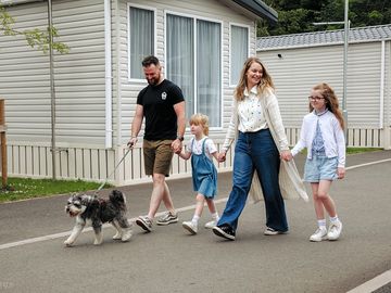 Family walking through our caravans for hire at castlewood holiday park, antrim