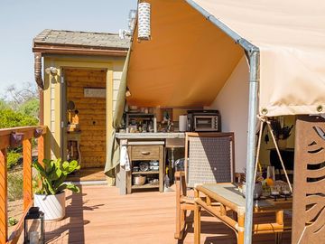 Camp kitchen and dining table on the decking