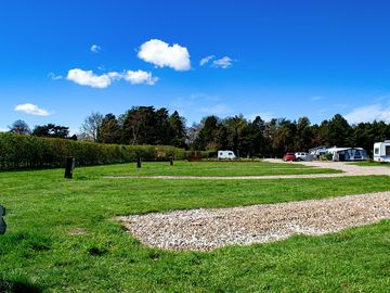 Electric hardstanding and grass touring pitch