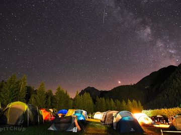 Tent pitches at night