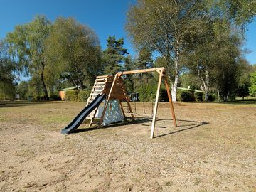 Playground surrounded by greenery