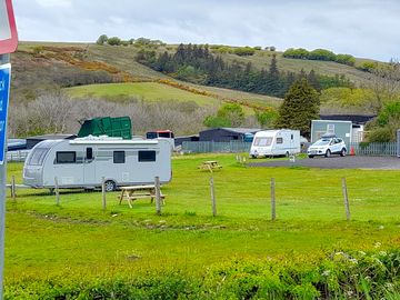 Both grass and hardstanding pitches with electric and fresh water nearby