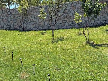 Grass tent pitch with lighting