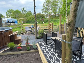 Private garden with a hammock and hot tub