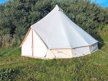 The bells tents are big enough for 5 to sleep in and have coir matting on the floor