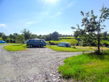 Campervans, caravans and motorhomes on their pitches