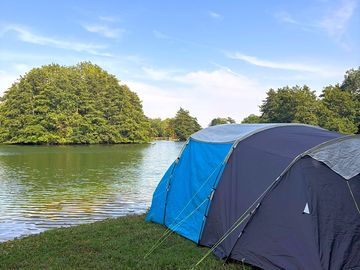 Side photo of the tent at the lake