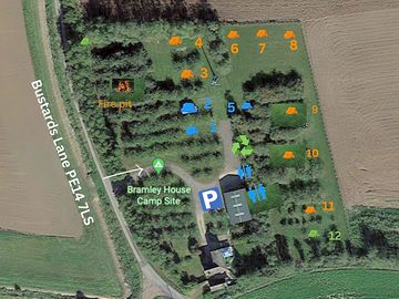 Aerial view showing pitches among the apple trees