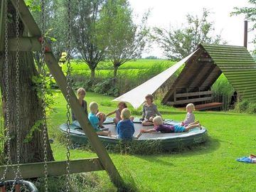 The trampoline and the firepit hut