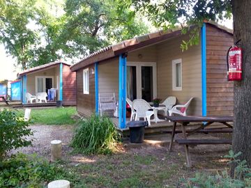 Wooden lodges with outdoor furniture