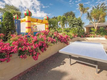 Bouncy castle and outdoor ping pong table