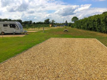 View from pitch across the communal area behind the pitches