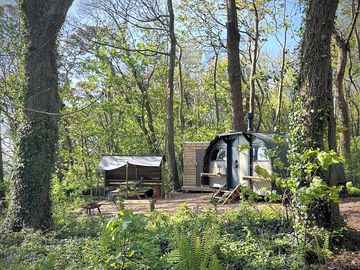 Saltings Eden Landpod, with adjacent bathroom and outdoor kitchen