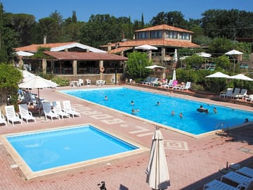 The swimming and paddling pools surrounded by a sun terrace