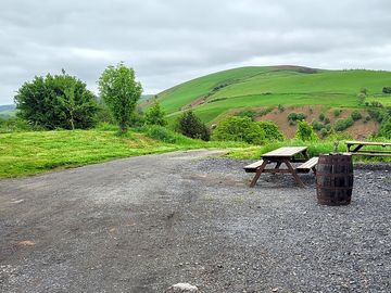Hardstanding with picnic tables by the cider barn