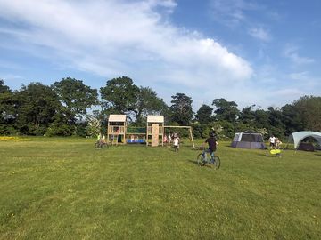 Grass non electric pitches overlooking the children’s play area