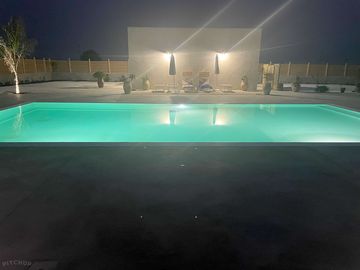 Pool and sun deck at night