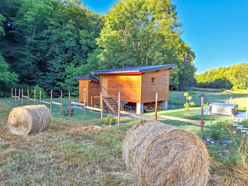 Lodge set in farmland and backed by trees